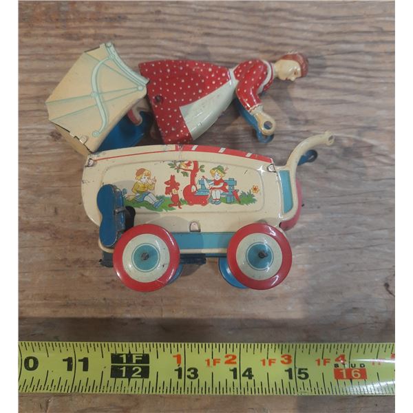 Vintage 1950's Hasitin Litho wind up red mother pushing a carriage. (Working) Rare.