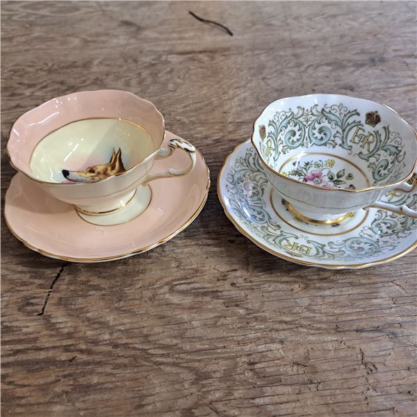 2 china tea cups and plates