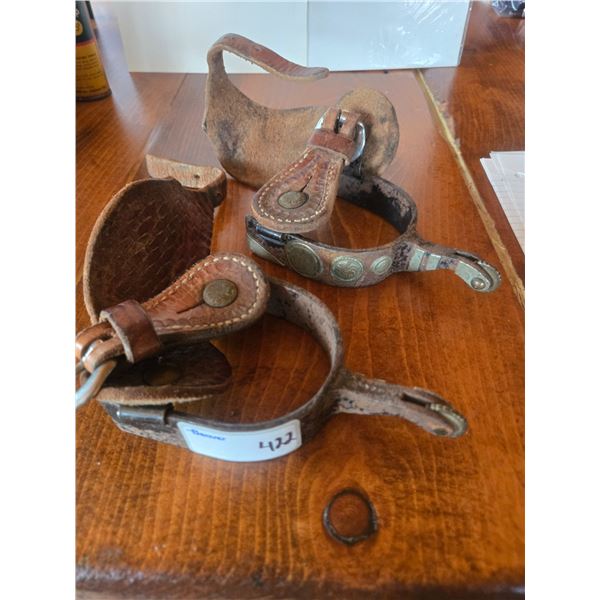 Pair of vintage spurs with silver circle inlay decorations. In good condition