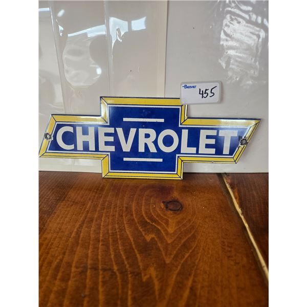 Die cut porcelain Chevrolet bow-tie sign 11in wide x 4in tall. Siongle sided fantasy