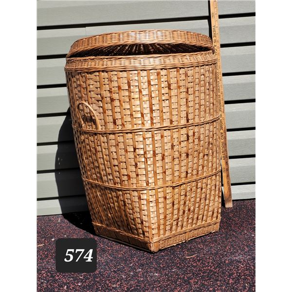 Large lined wicker laundry basket. Approx. 29” high.