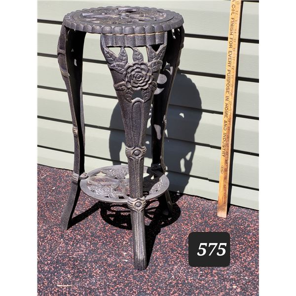 Decorative cast iron plant stand.