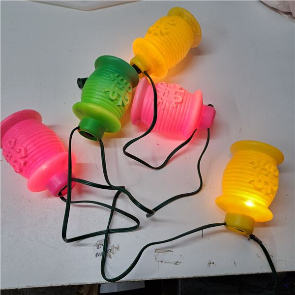 String of plastic paper lantern styled patio lights