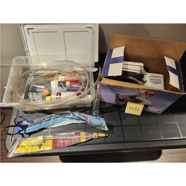 Various Winemaking supplies: wine filtration machine, degassing tool, heat belt, hydrometer, thermom