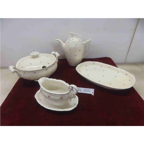 soup tureen and platter, tea or coffeer pot, and a gravy boat. 