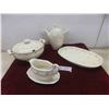 Image 1 : soup tureen and platter, tea or coffeer pot, and a gravy boat. 