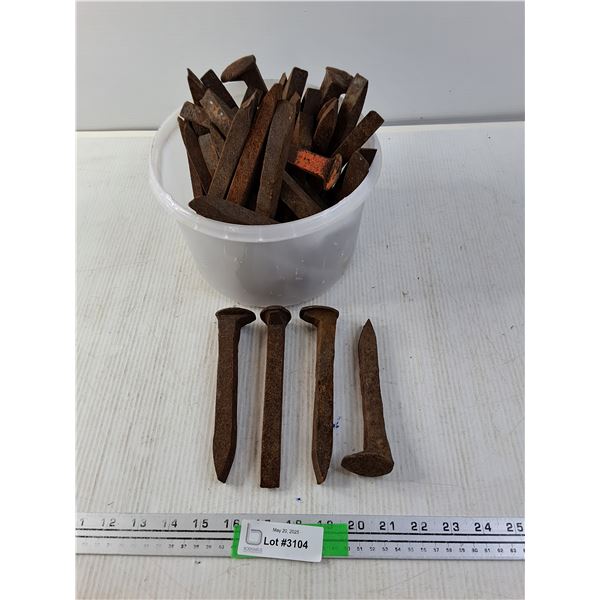 Ice Cream Pail full of Railway Spikes