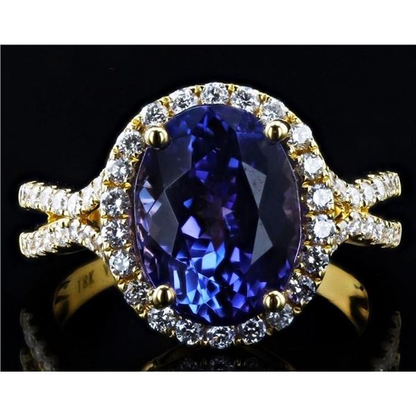 5.82CT TANZANITE & 0.69CTW DIAMOND 18K GOLD RING