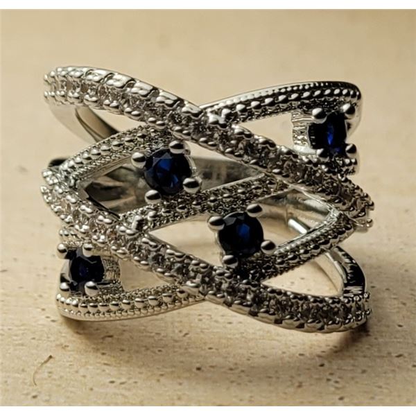 7)  SAPPHIRE BLUE AND CLEAR CZ SIZE 7 CRISS/CROSS