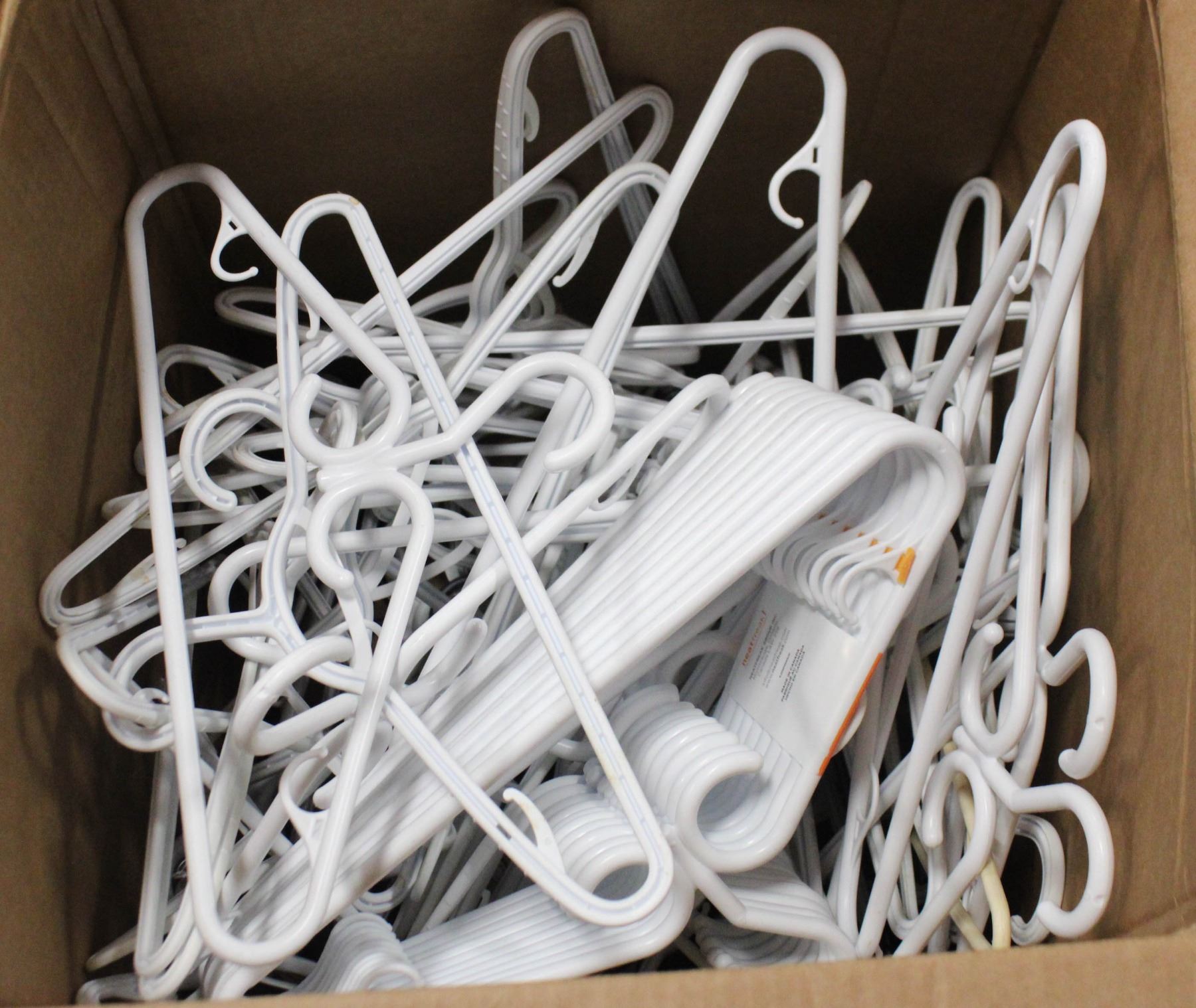 LARGE BOX OF PLASTIC HANGERS