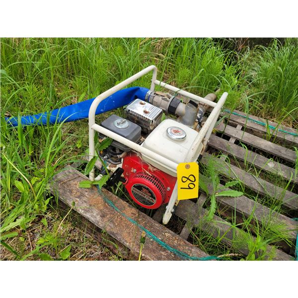 Honda 2in. water pump c/w 100ft. 2in. hose, running order