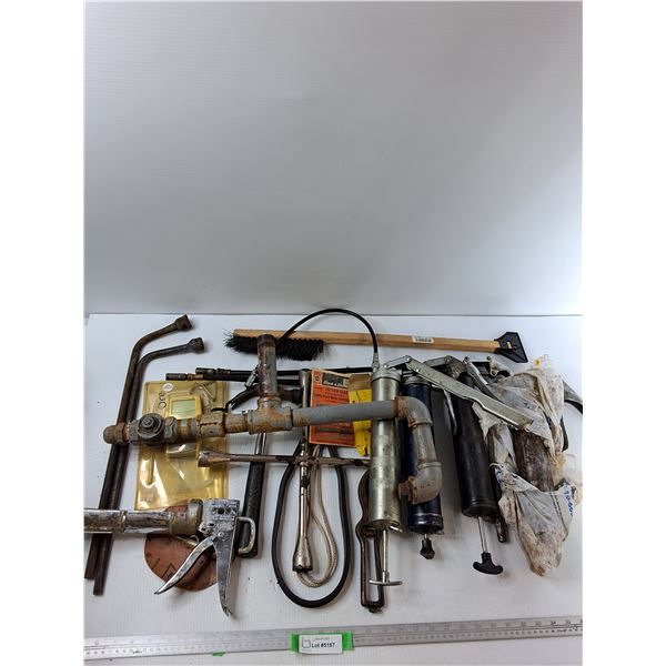 (4) Grease Guns, (2) Tire Irons, Hammer, Misc