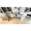 Image 2 : BAKER RACK, IRONING BOARD, BLACK & DECKER IRON, PLASTIC BIN OF WASH TOWELS