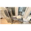 Image 5 : BAKER RACK, IRONING BOARD, BLACK & DECKER IRON, PLASTIC BIN OF WASH TOWELS