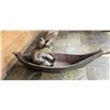 Image 1 : WOODEN BOAT WITH A MAN 53"X22".