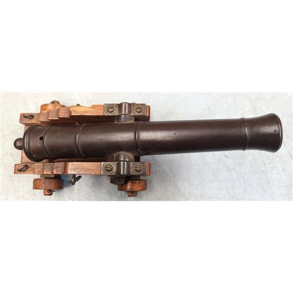 Canon Replica Antique Mini Canon on wood base.