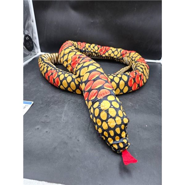 Aprox 3′ Plush Snakelike Toy With Black, Yellow, And Red Patterns