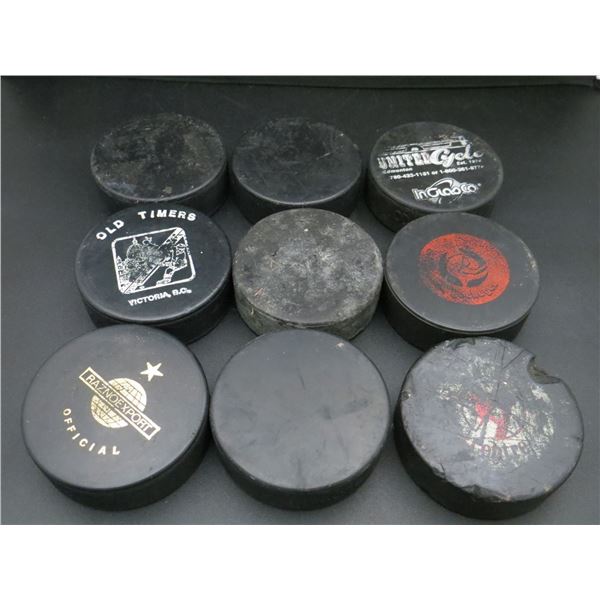 Lot Of 9 Various Used & Unused Hockey Pucks