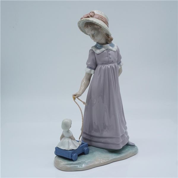Lladro Porcelain Figurine, Girl with Toy Wagon 01005044