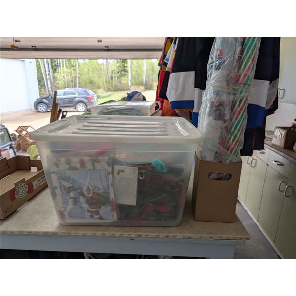 Tubber ware Box full of Christmas decorations and etc. w/ Christmas wrapping paper