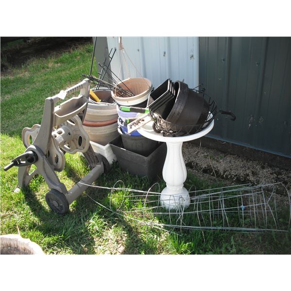hose reel, plant pots, plstic bird bath, garden tools, tomato cages, etc.