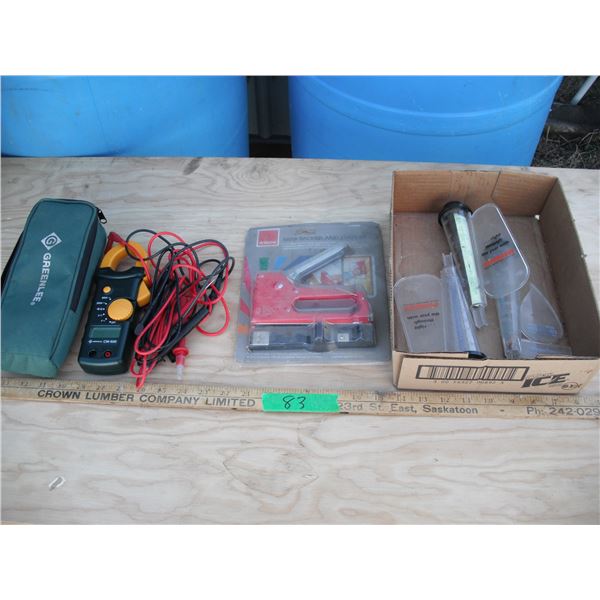 Greenlee CM-600 voltage tester, stapler and rain gauges