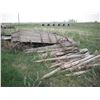Image 1 : 2x wagons with 25" & 28" steel wheels, and assorted poles, barbed wire, boards, etc.