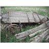 Image 3 : 2x wagons with 25" & 28" steel wheels, and assorted poles, barbed wire, boards, etc.