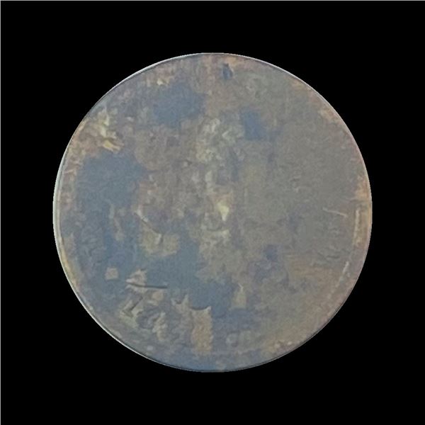 The coin appears to be a heavily corroded U.S. Shield Nickel but the year and mint mark are not visi