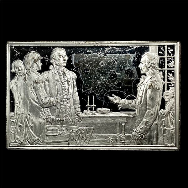 This is a silver bicentennial commemorative ingot. It depicts a historical scene related to the Amer