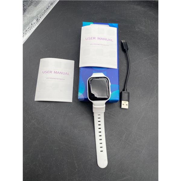 Smartwatch with White Band and Charging Cable