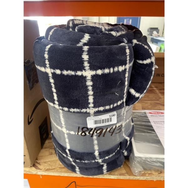 Blue and White Checked Fabric Roll with Markings 1849143