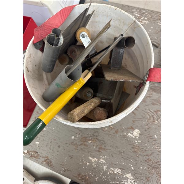 pail of trowels, scrapers and putty knives