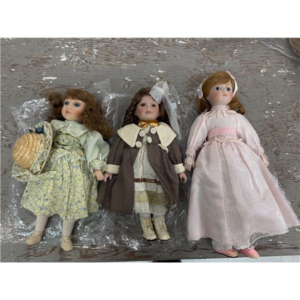 Three porcelain face dolls