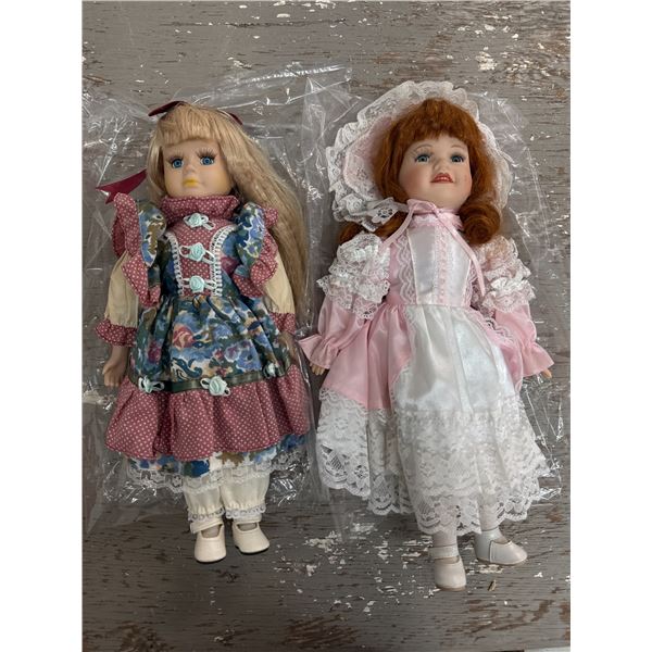 Two porcelain face dolls