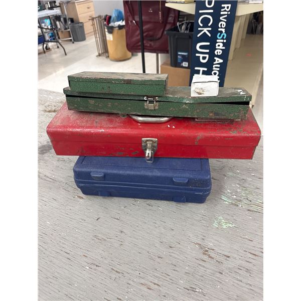 Four empty toolboxes