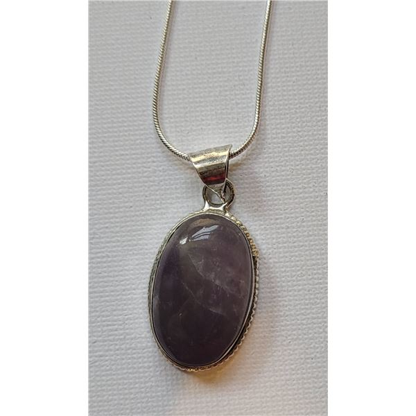 15) NATURAL OVAL BEZEL SET AMETHYST PENDANT