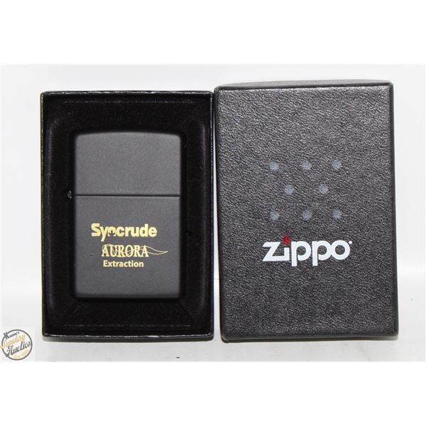 NEW ZIPPO LIGHTER IN ORIGINAL CASE. SYNCRUDE