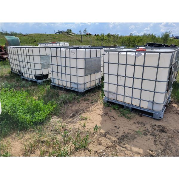 Group of 4 water totes in cages. C/w lids, and valves.