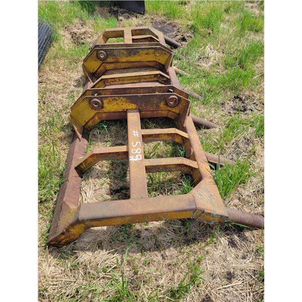 Brush rake for cat loader.