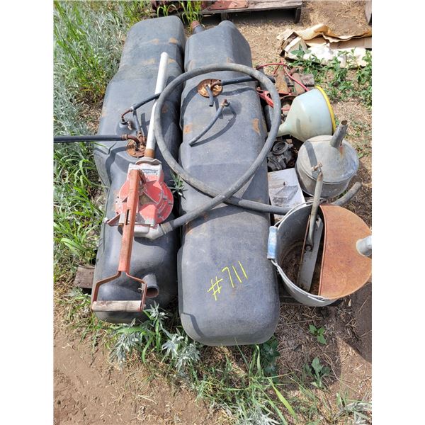 Assorted fuel tanks, funnels, pump.