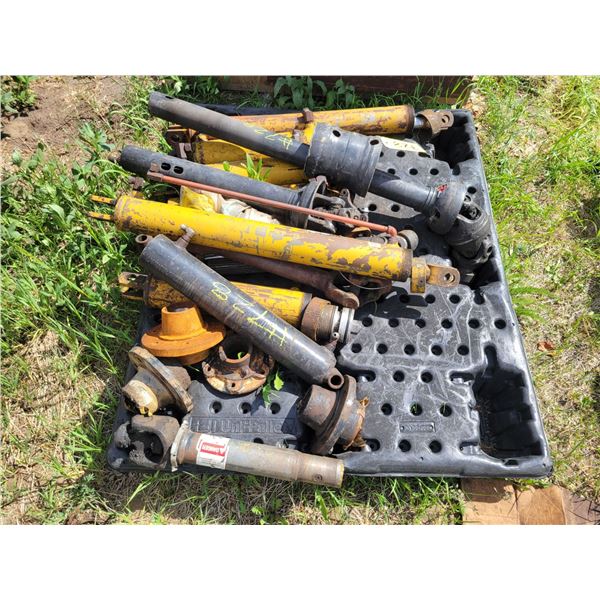 Assorted PTO shafts, rams for parts.