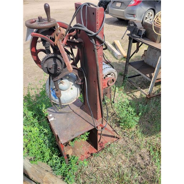 Antique drill press. Converted to power. Wrench.