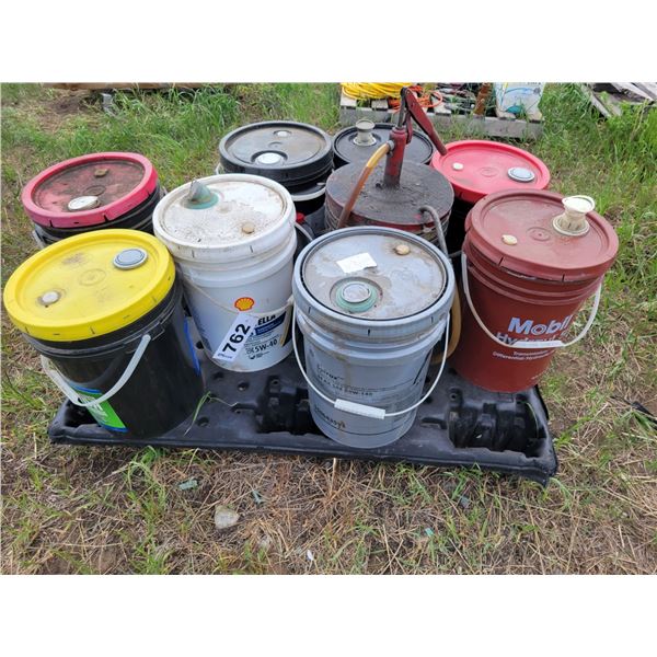 Pallet of oils, and floor pump.