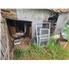 Image 1 : Contents of wood building including  plywood, windows, barrels and misc outside front of building
