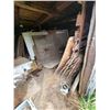 Image 4 : Contents of wood building including  plywood, windows, barrels and misc outside front of building