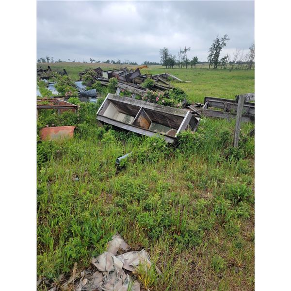Yellow calf shed frame, steel door, and large Qty  of various roofing, cedar posts, tin, shelf etc.