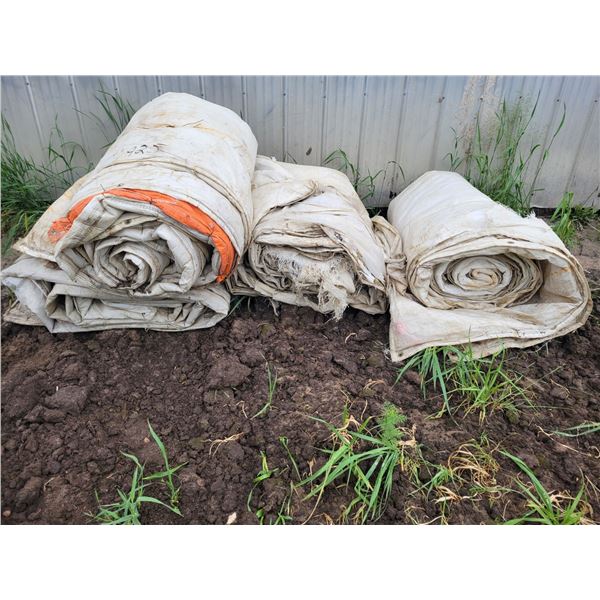 Approx 4 white tarps.