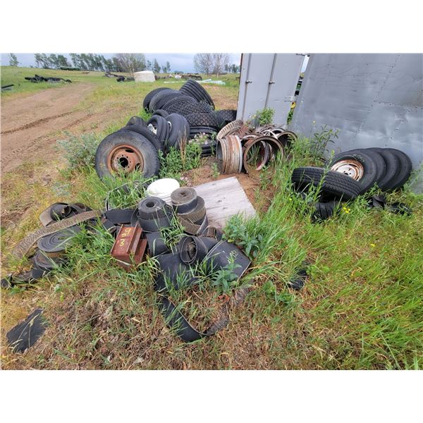 Qty  of tires of various sizes, rims, belting rolls.