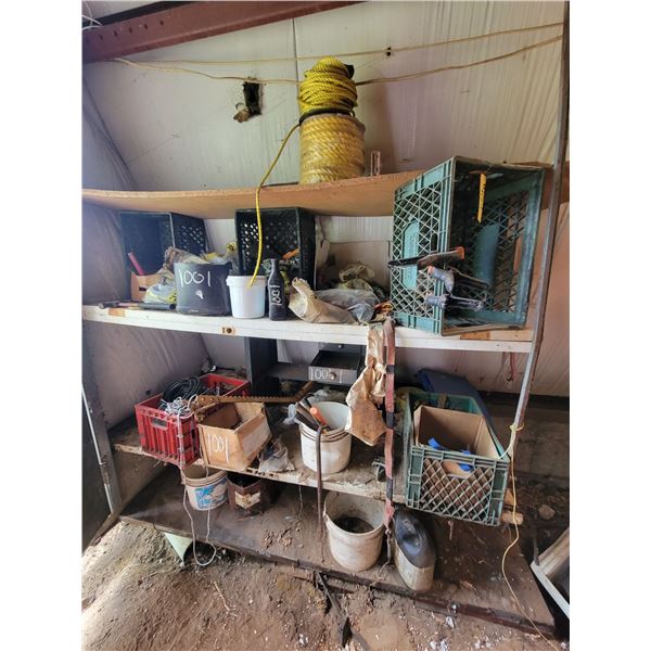Contents on west wall of shop. clamps, fence stretcher, elec.insulators,rope , tarp and misc.
